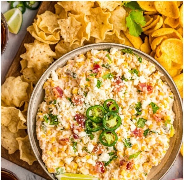 Delicious crack corn dip served in a bowl with chips