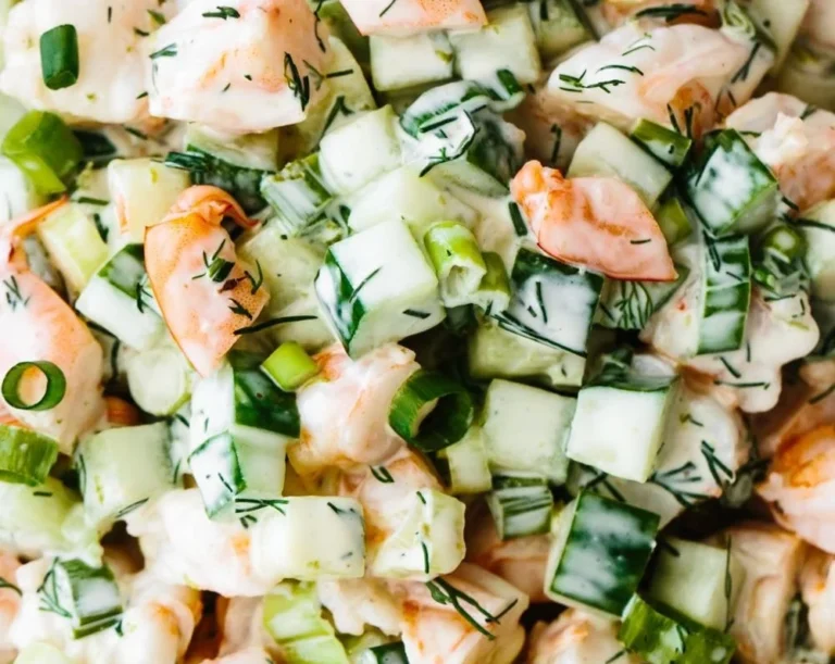 Delicious shrimp and cucumber salad served in a bowl.