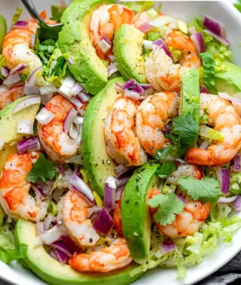 Delicious shrimp avocado salad garnished with fresh ingredients.