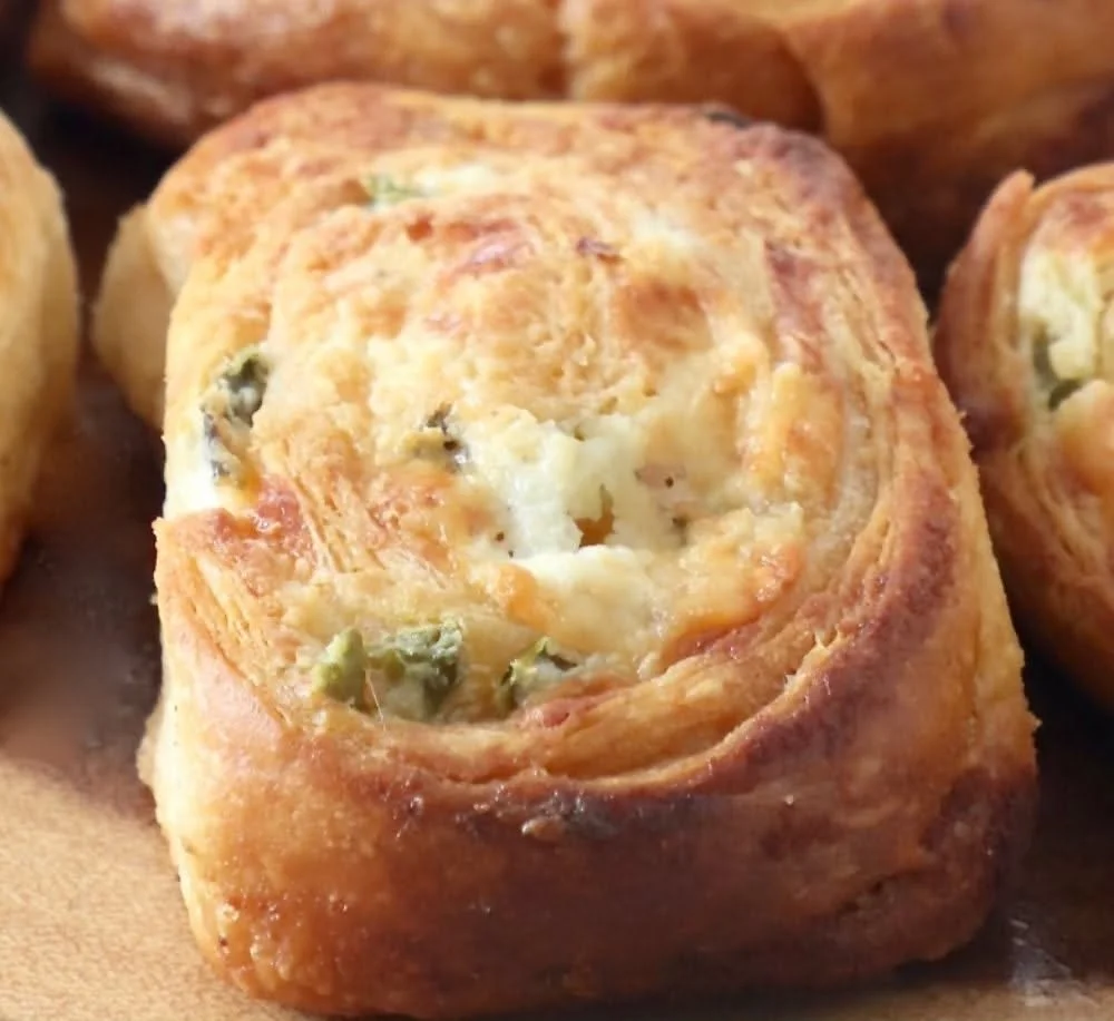 Spicy Jalapeno Popper Crescent Rolls garnished and served on a plate