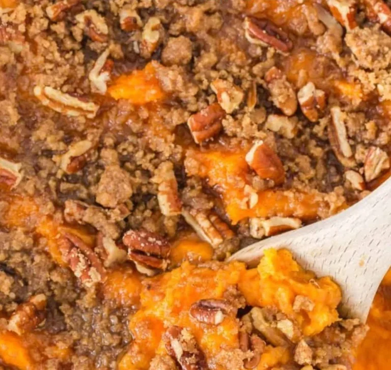 Delicious homemade sweet potato casserole topped with marshmallows and pecans