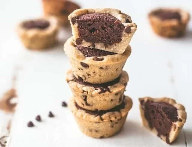 Decadent brownie tarts served on a plate, perfect for dessert lovers.