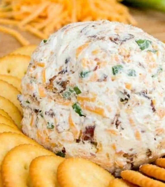 Homemade Cheddar Ranch Cheeseball served with crackers and vegetables