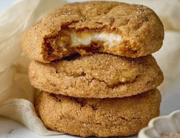 Chewy pumpkin cheesecake cookies with cream cheese frosting and cinnamon.