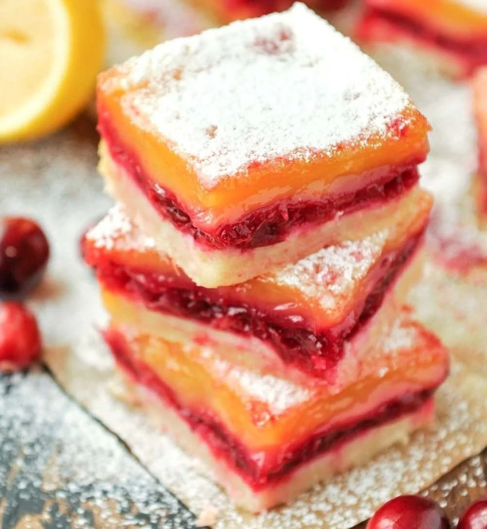 Delicious homemade cranberry lemon bars served on a white plate