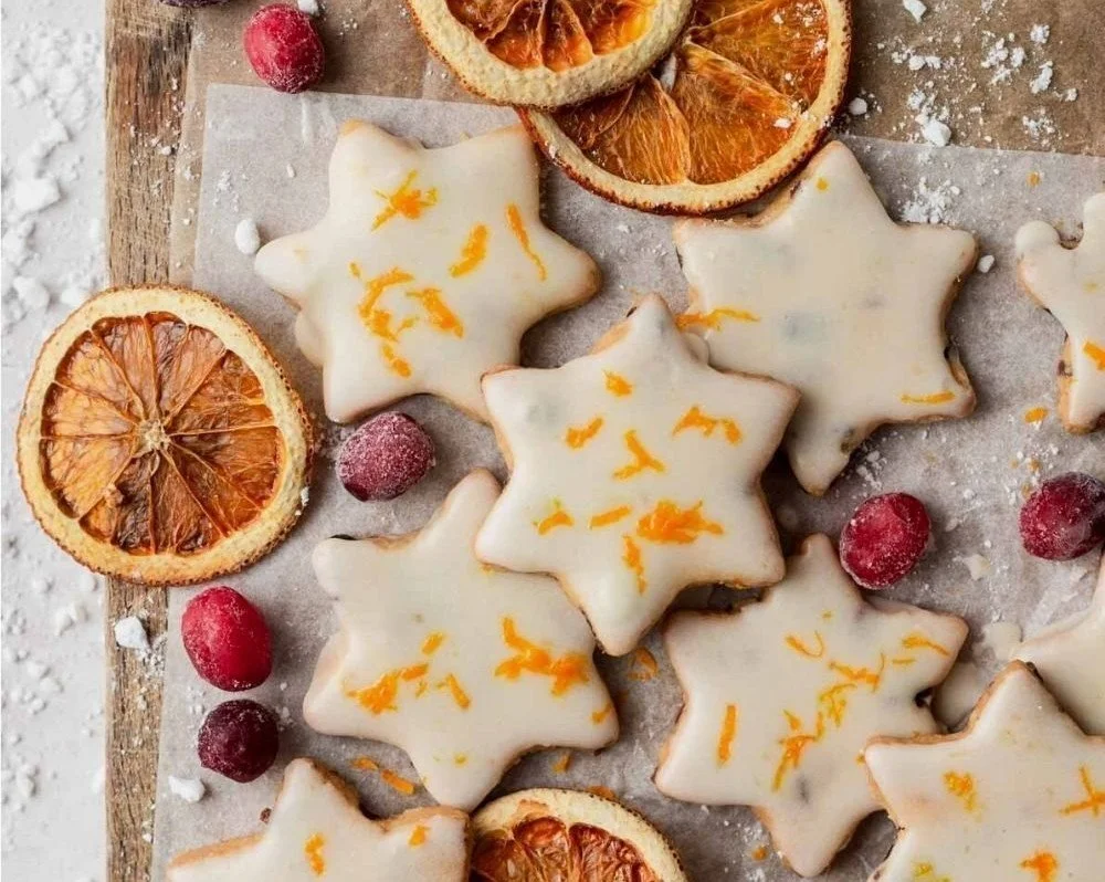Freshly baked cranberry-orange shortbread cookies on a cooling rack