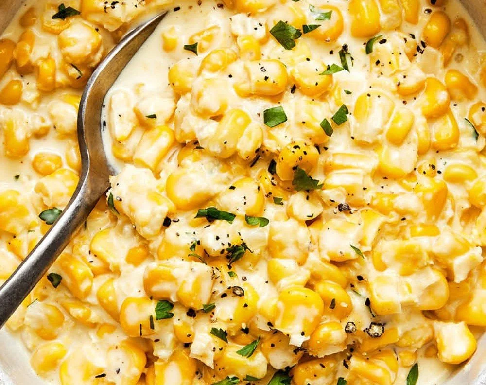 Delicious creamed corn served in a bowl, perfect for Thanksgiving dinner.