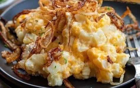 Delicious Funeral Potatoes with French Onion flavor served in a casserole dish.