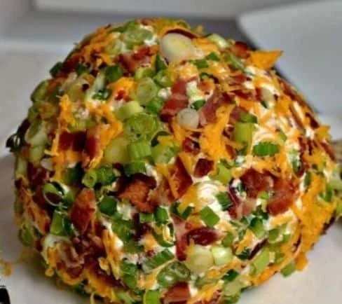 Jalapeno popper cheese ball served with crackers and vegetables